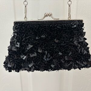 Bijoux Turner Black Beaded Clutch
Silver trim and chain, snap closure.  EUC